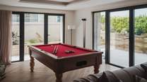 On the first floor, a games room offers a sublime place to while away the hours
