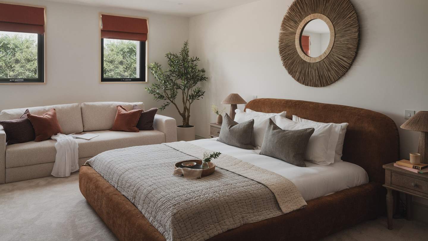 A comfortable sofa sits at the far side of the room, creating a soothing spot for unplugged rest