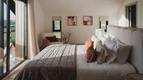 The master bedroom features a decadent super king bed