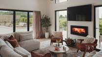 Recline on the generous sofa and settle in for cosy evenings in front of the Smart TV