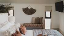 Set on the ground floor, it offers a dreamy outlook across countryside and coast