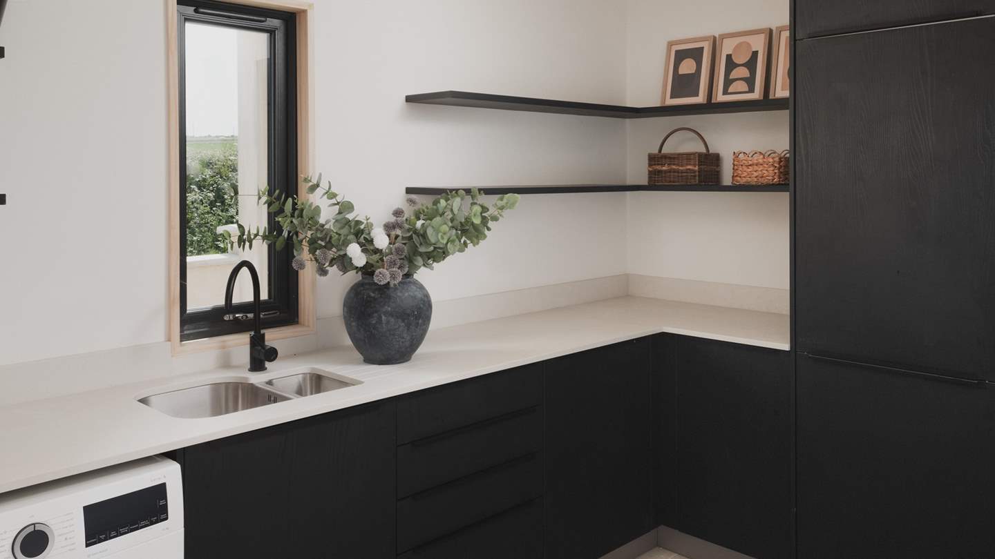In a separate utility room, you’ll find a washing machine and tumble dryer