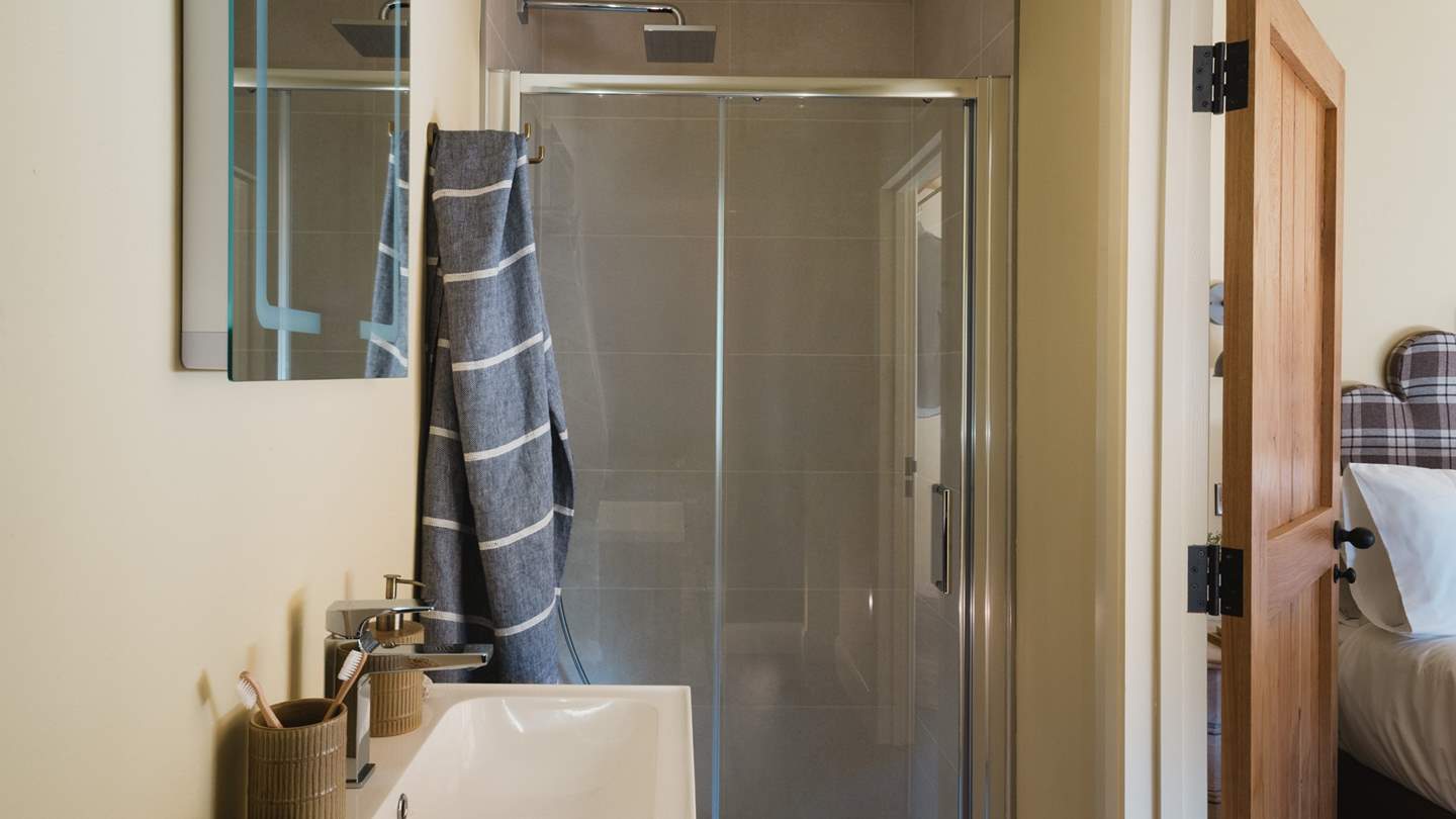 Adjoining is the contemporary en suite bathroom, complete with a walk-in rainfall shower for the lovers of slow morning rituals