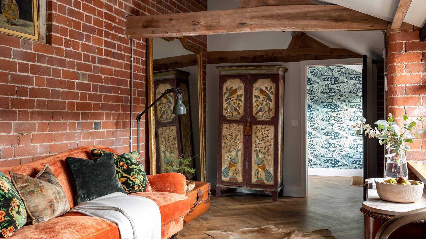 Settle into the burnt orange Tetrad sofa for a dose of quietude