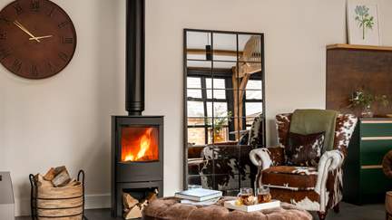 Cosy  up for fireside evenings beside the wood burning stove...
