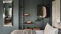 A dressing table, open shelving and a hanging rail await to store your garments