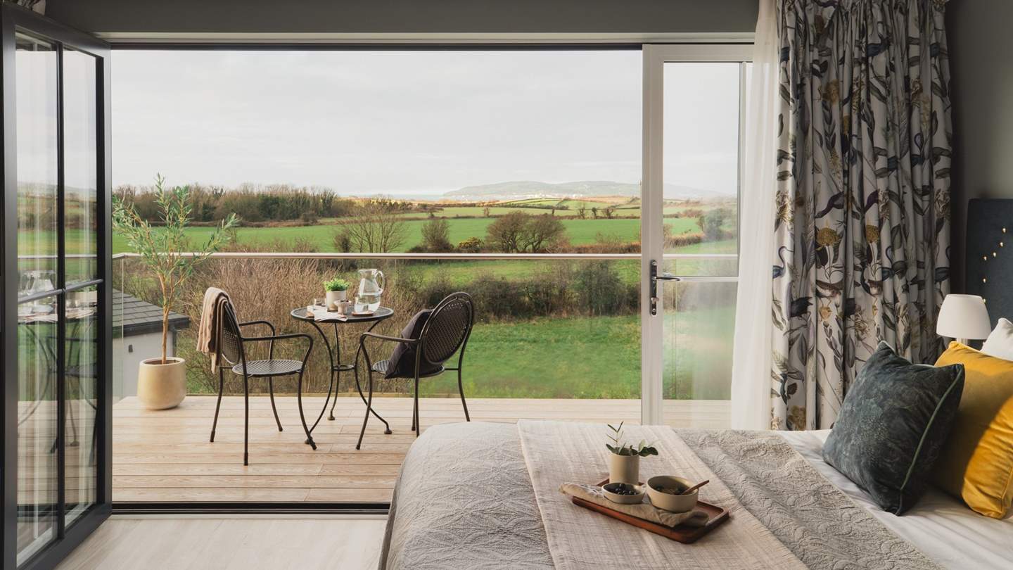 Admire distant coastal vistas from your bedroom