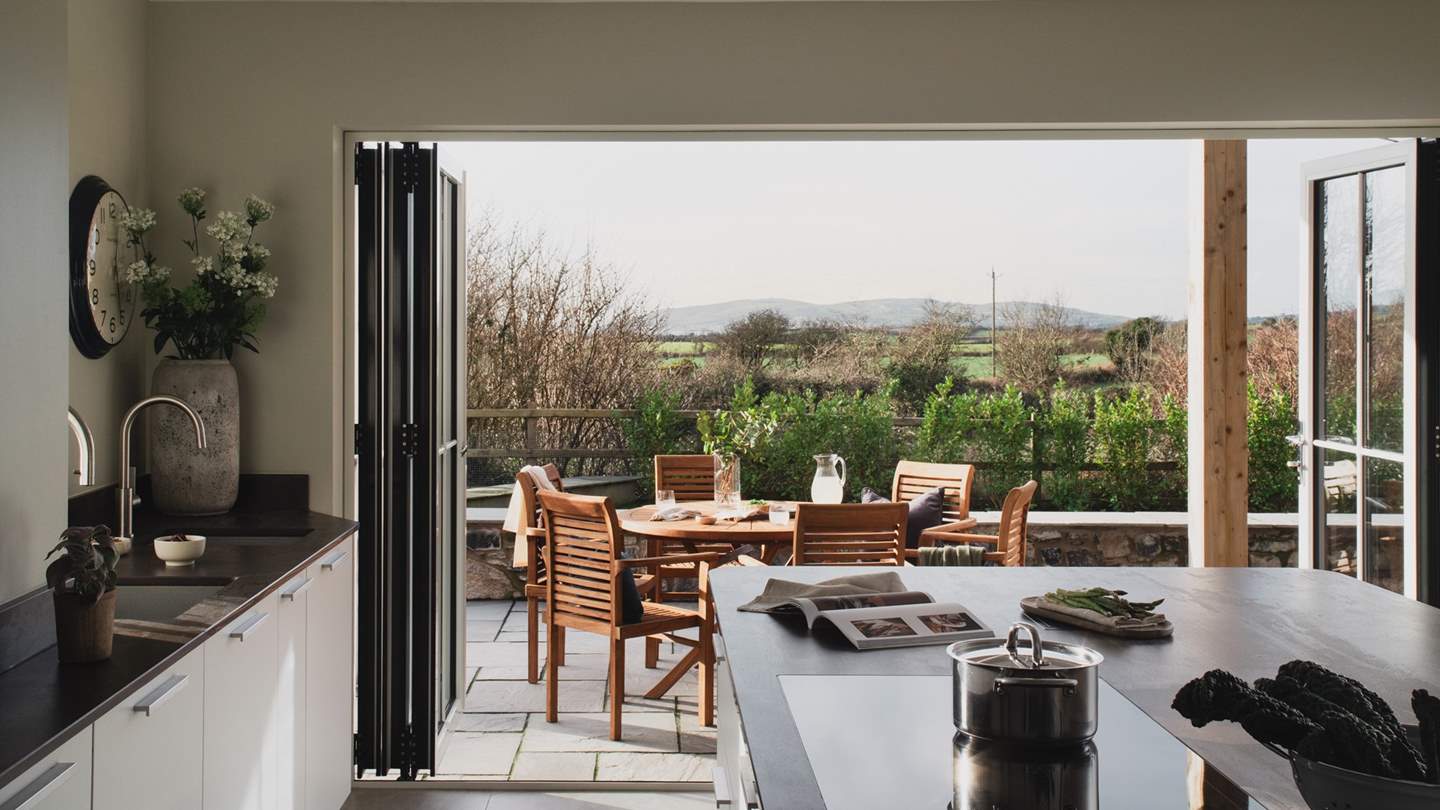 Open the doors on a balmy summer’s day and admire the distant sea views