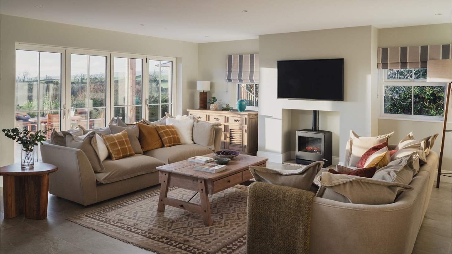 The first light-filled living room offers a serene space to gather