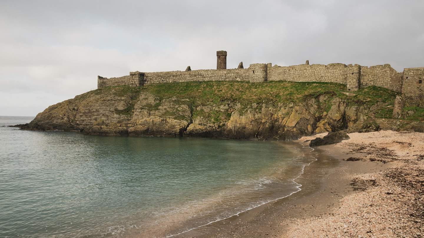 Take a stroll across Fenella beach, settled below Peel Castle 