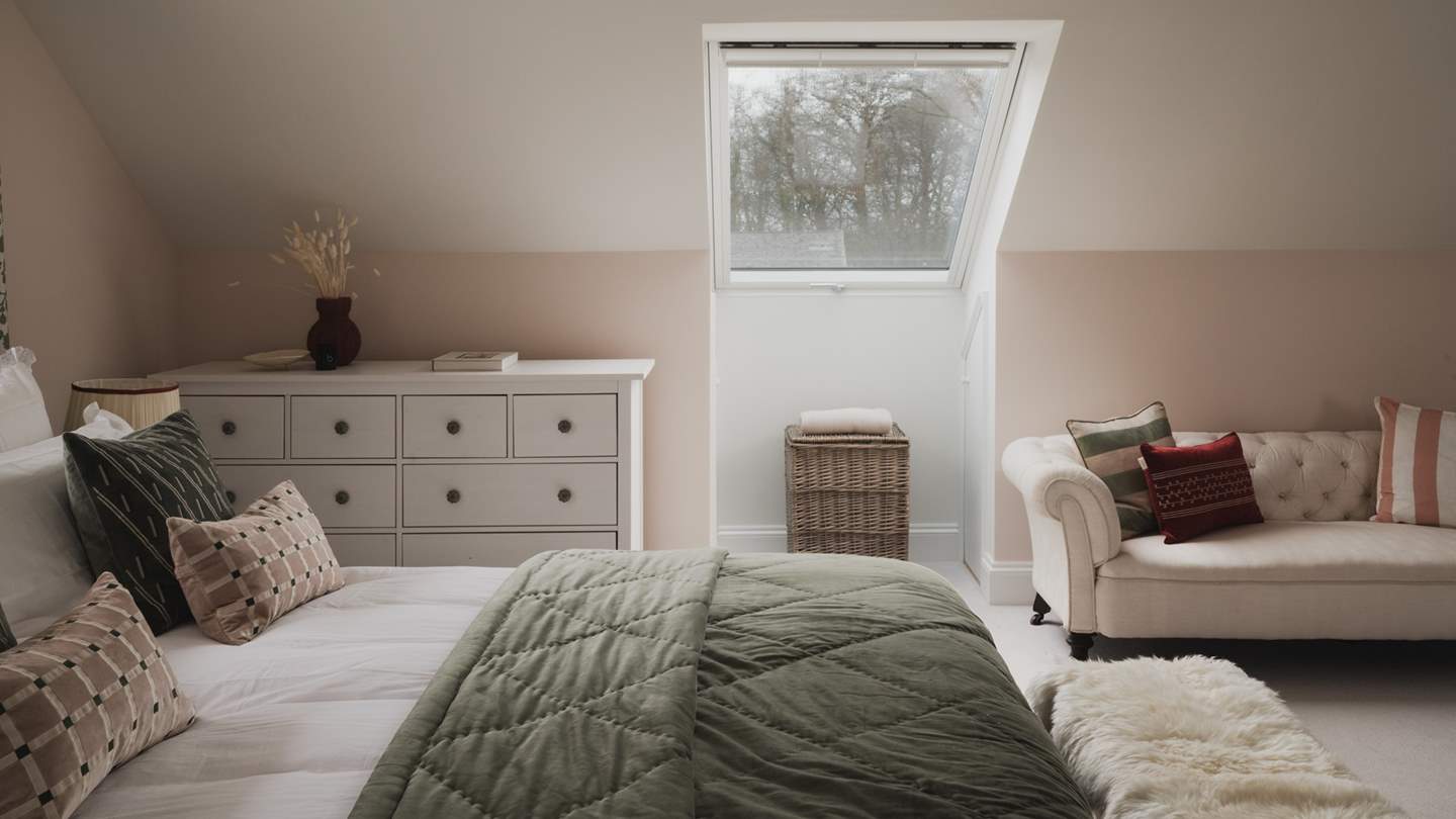 For stowing belongings, there are two chests of drawers, two large, fitted wardrobes with ample hanging space