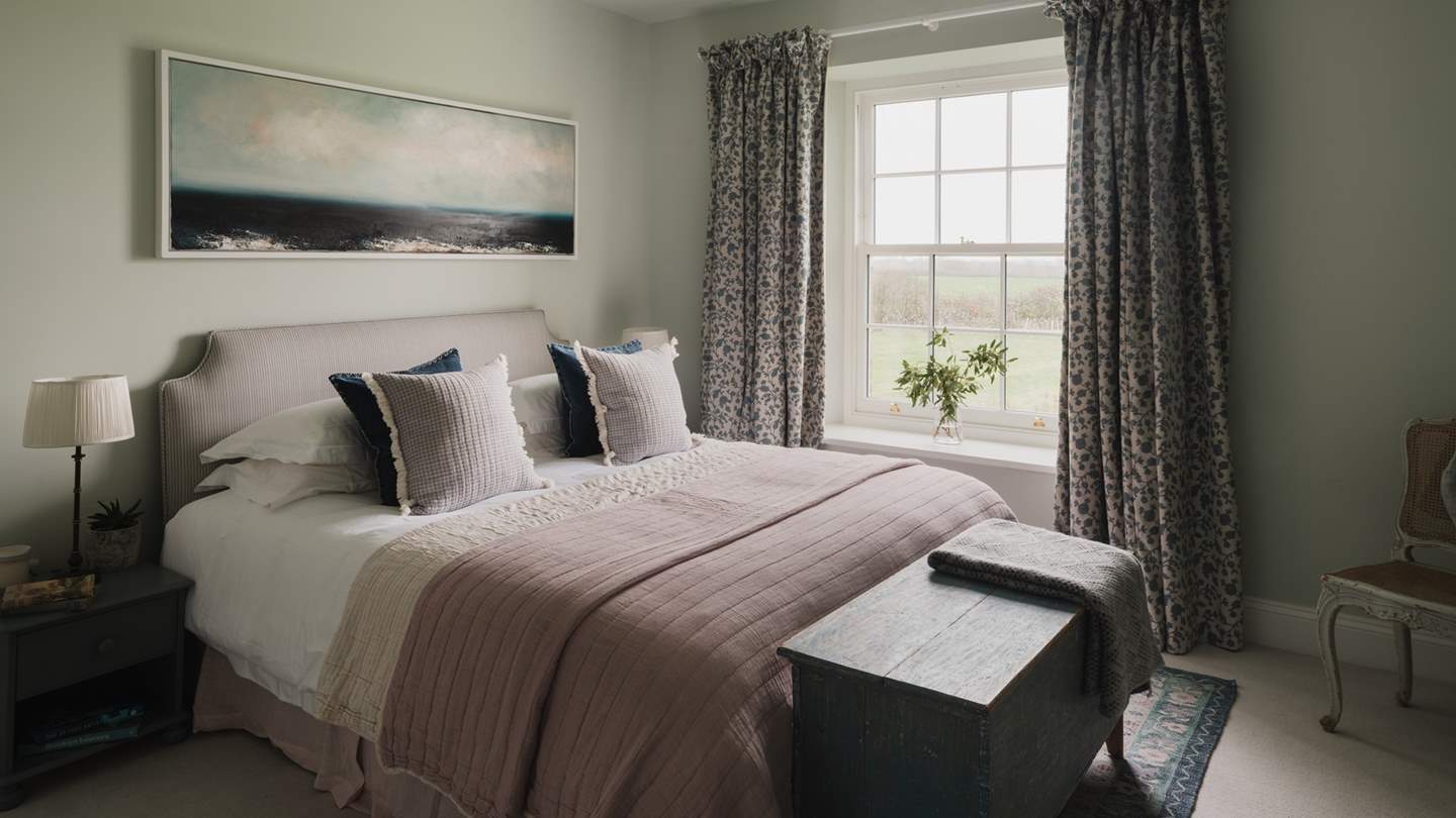 With high ceilings and a feature fireplace, the second bedroom exudes Victorian charm