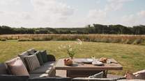 A large outdoor table sets the scene for leisurely meals alfresco