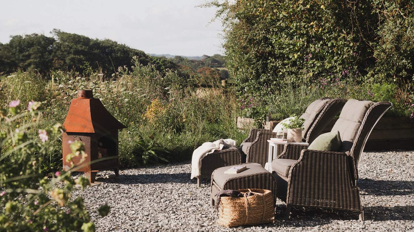 Settle beside a leafy canopy for moments of calm on sun-soaked afternoons