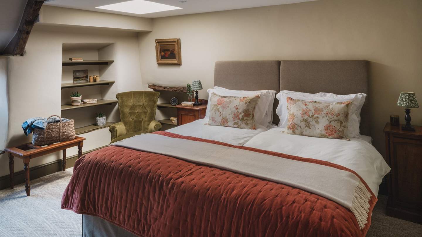 To the front of the cottage, uncover the master bedroom of dreams