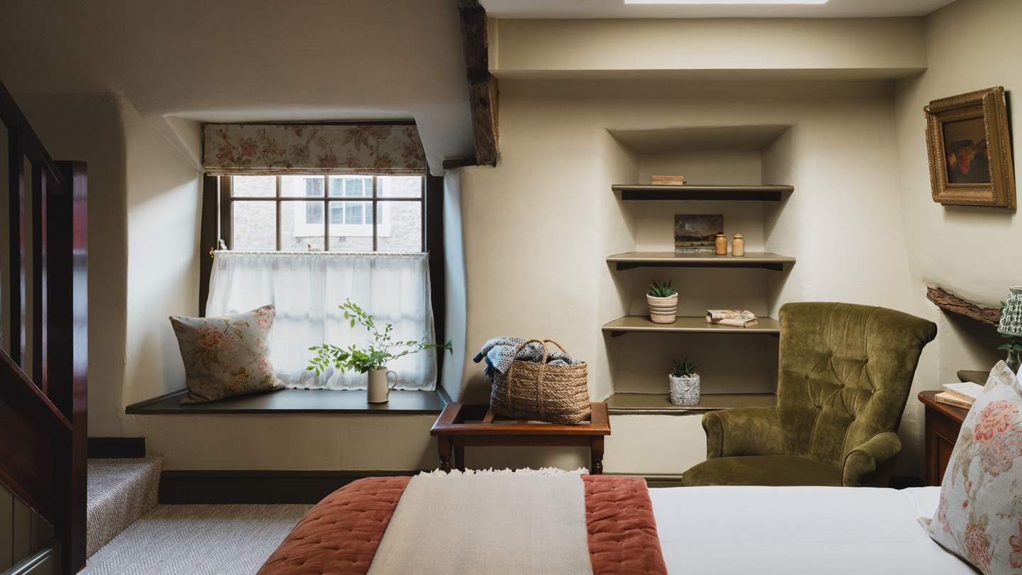 Discover a bewitching space with mahogany, moody olive greens and burnt orange hues