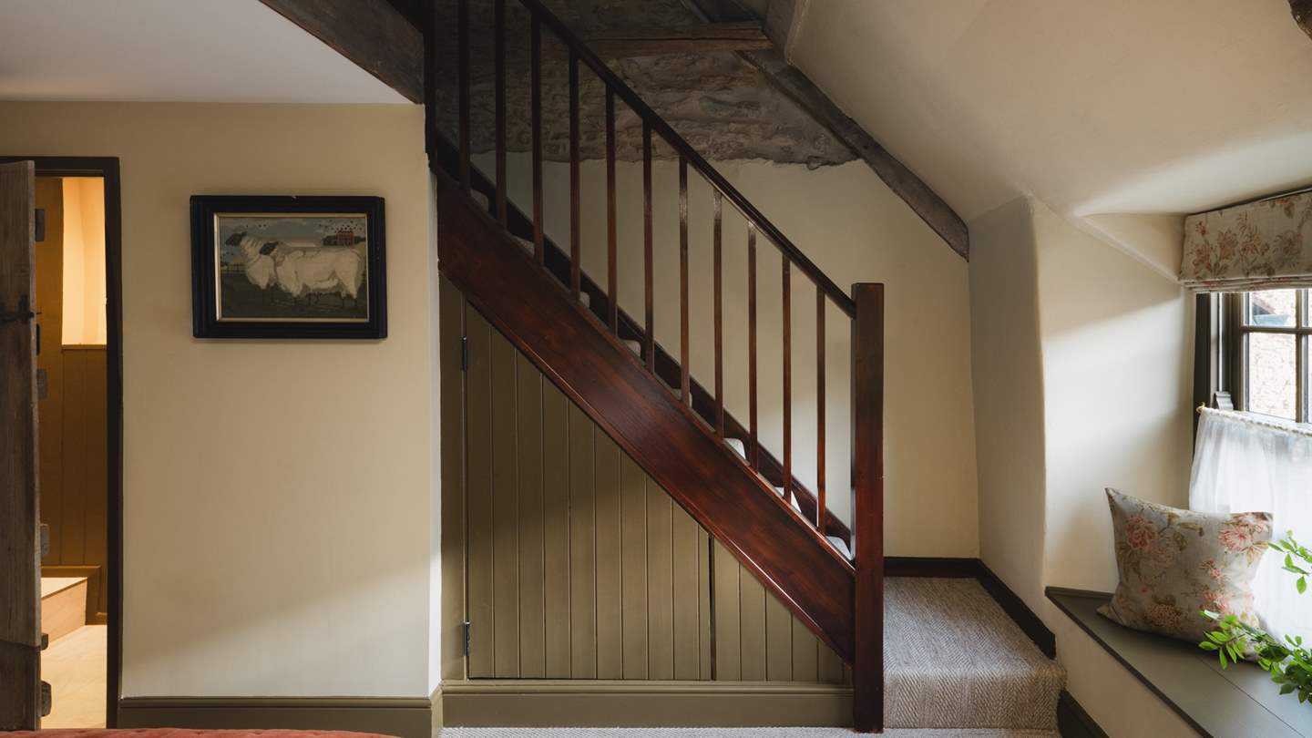 Climb the final staircase to the eaves of the cottage where a sanctuary for self-care awaits