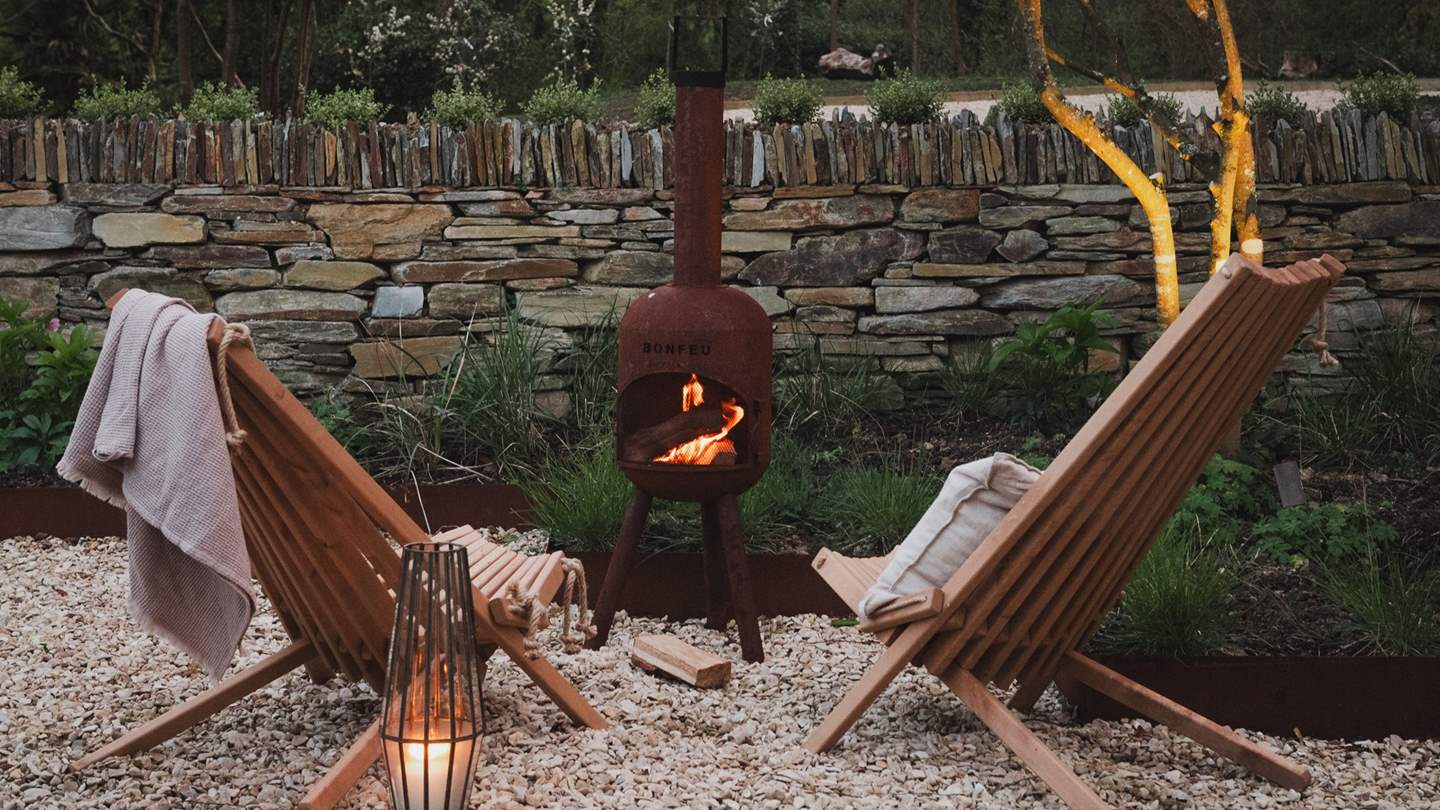 A rustic chiminea awaits for ambient nights beneath the stars