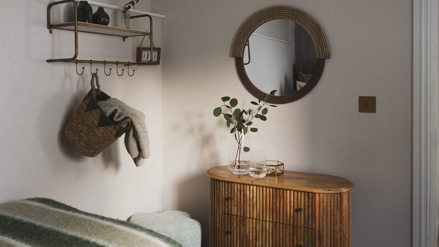 You'll also find a chest of drawers and hanging space for storing your belongings 