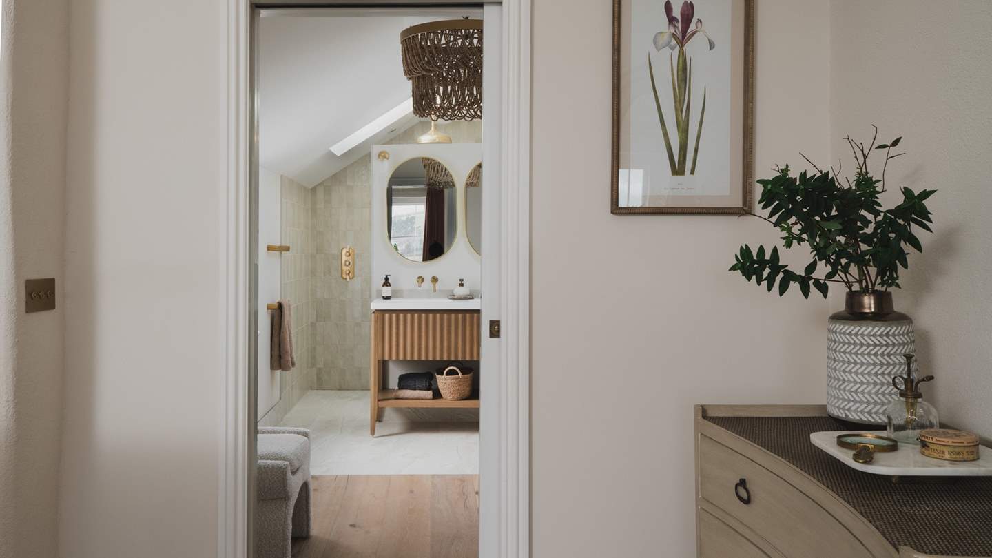 Meanwhile, an ensuite bathroom can be found behind a sliding door