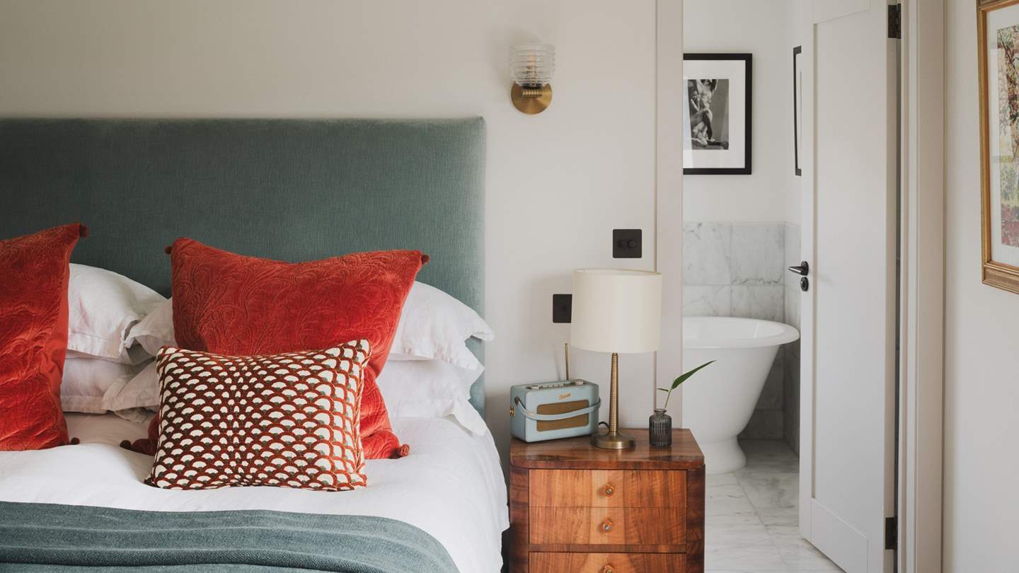 Calming tones adorn the space and sumptuous furnishings invite restful repose