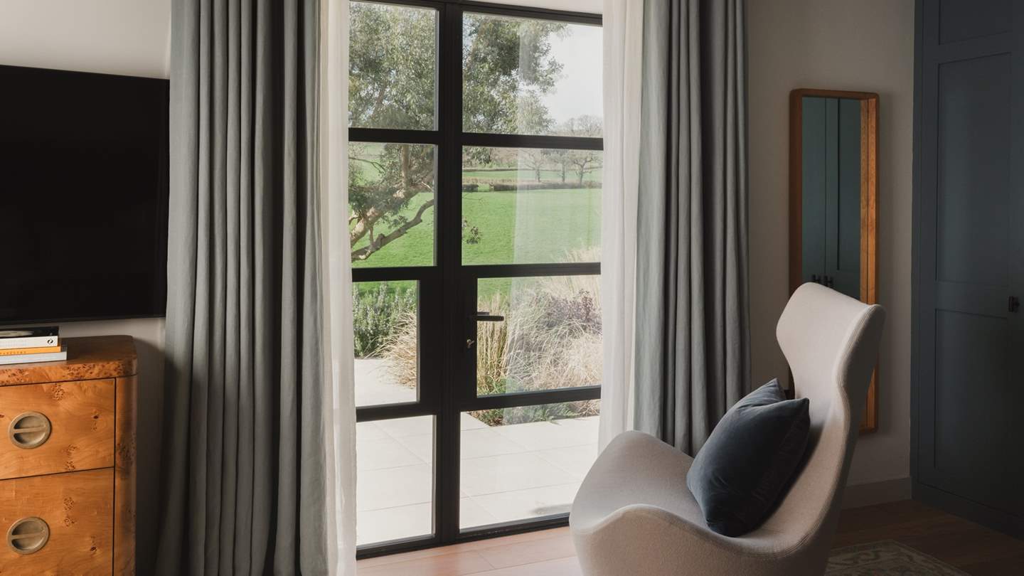 Two vintage bedside tables and a fitted wardrobe promise plenty of space to stow treasures