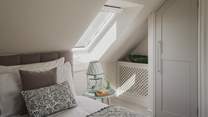 For stowing belongings, there’s a built-in wardrobe and chest of drawers