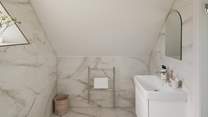 Complete with a heated towel rail to ensure towels remain fluffy and warm
