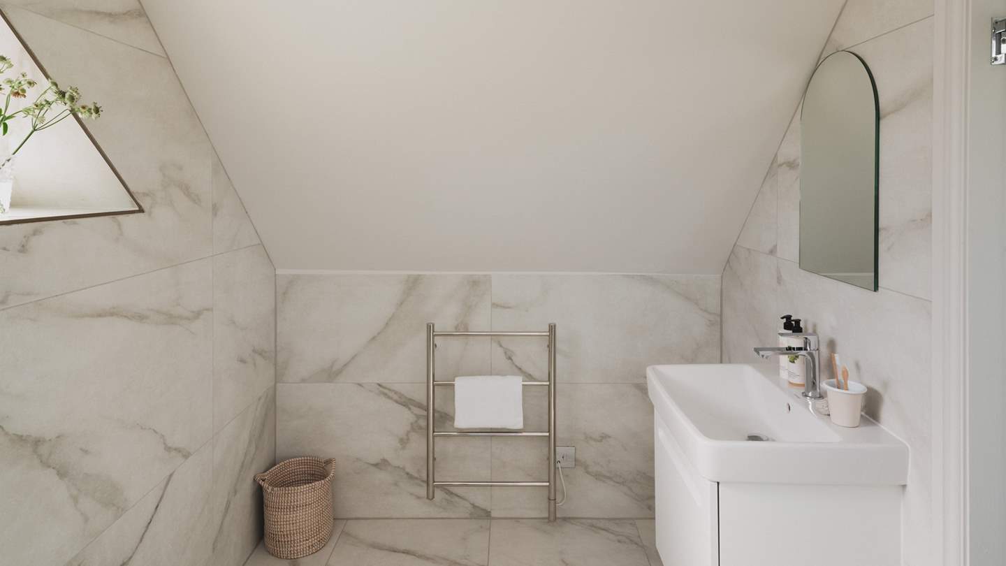 Complete with a heated towel rail to ensure towels remain fluffy and warm