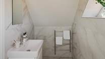 Complete with a large rainfall shower and separate handheld attachment, plus a heated towel rail