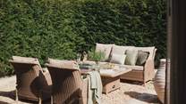With relaxed seating for four, complete with a table and parasol for sun-dappled afternoons spent alfresco
