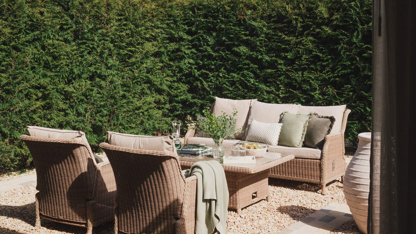 With relaxed seating for four, complete with a table and parasol for sun-dappled afternoons spent alfresco