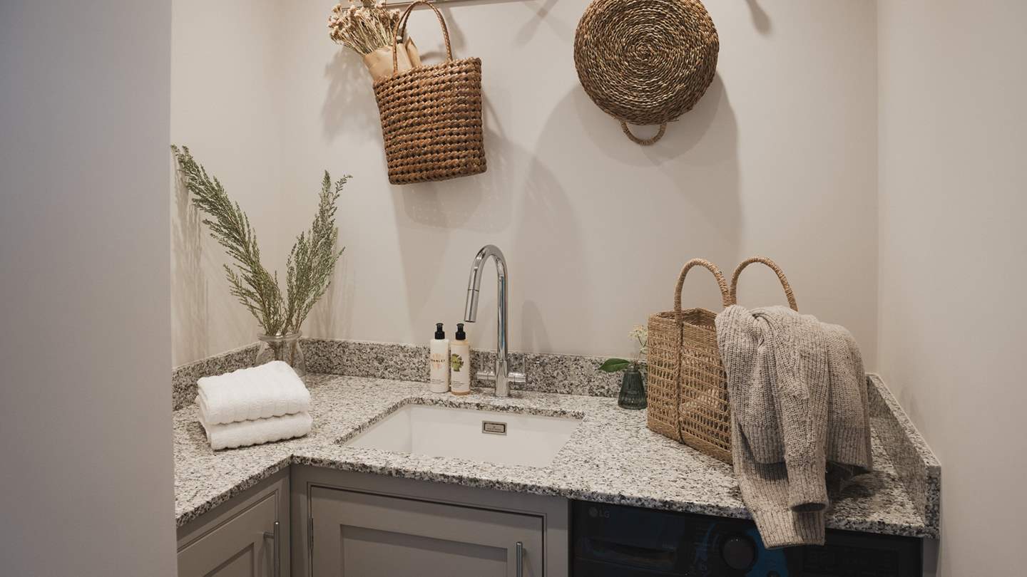 In addition, you’ll find a utility room with a washer/dryer for guest use