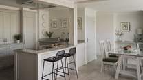 At the heart of the room, uncover a modern farmhouse style kitchen 