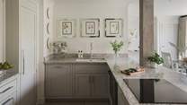 At the heart of the room, uncover a modern farmhouse style kitchen 