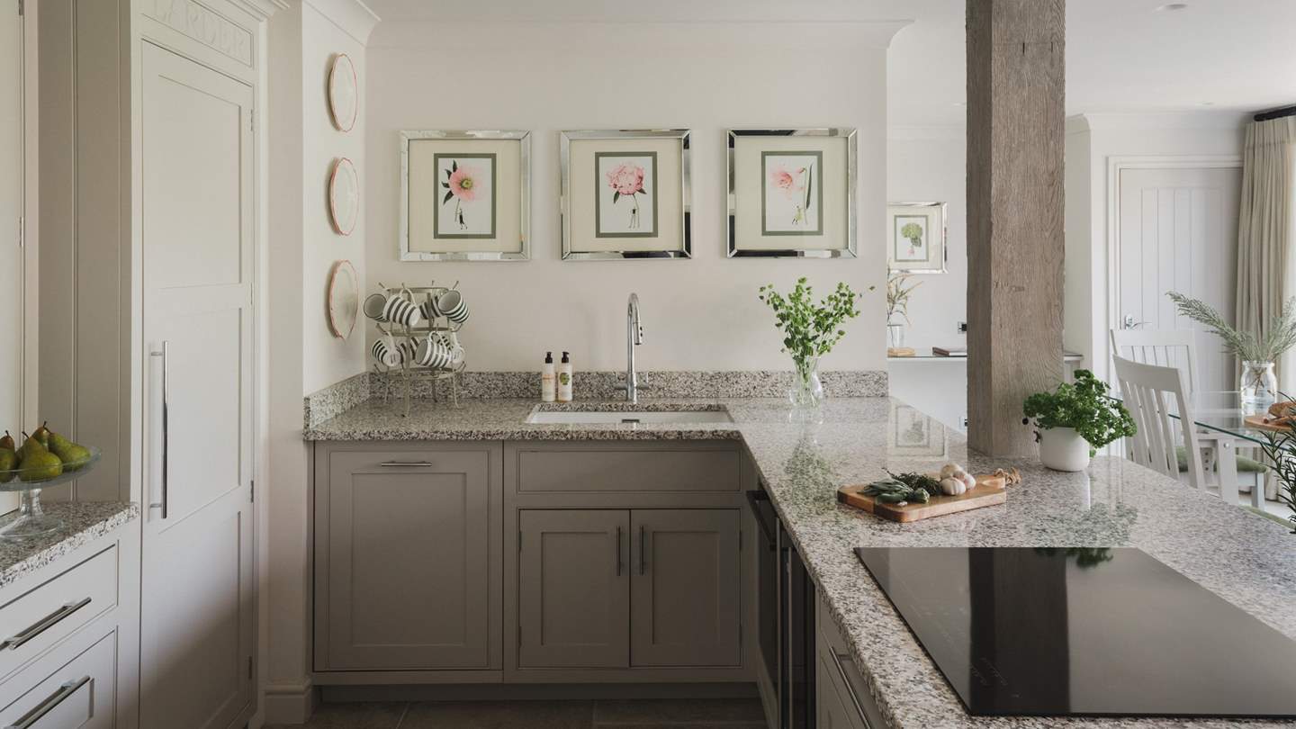 At the heart of the room, uncover a modern farmhouse style kitchen 