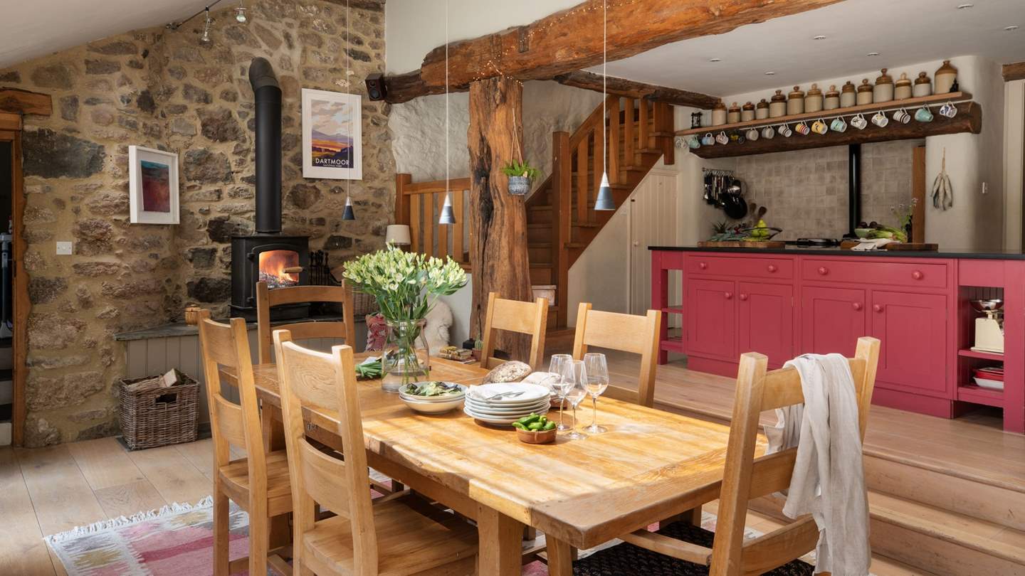 Exuding romantic rusticity with homely farmhouse styling, open beams, and exposed stonework, the kitchen space is a delight 