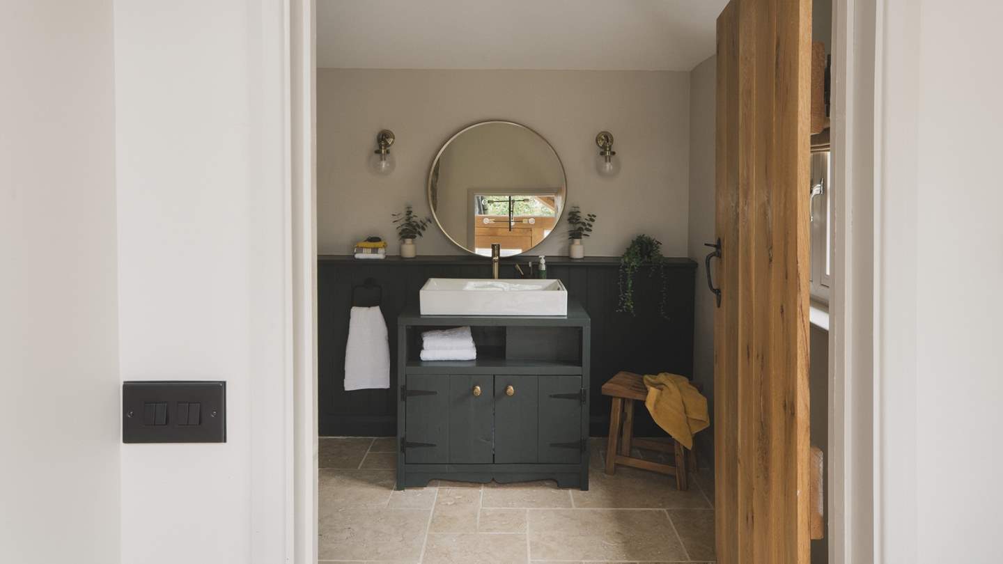 The beautiful bathroom resides downstairs...