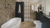 With underfloor heating, a heated towel rail and rainfall shower head with twin attachment