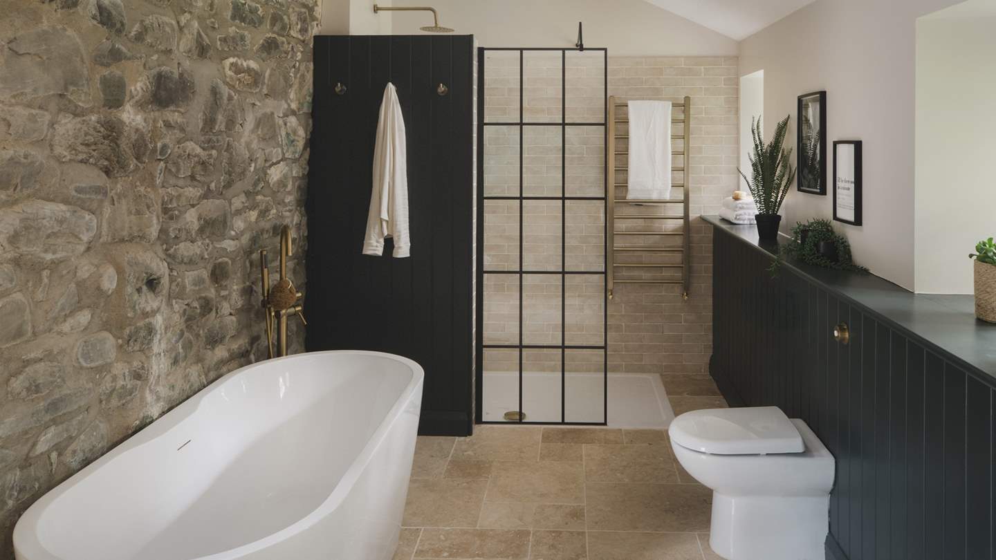 With underfloor heating, a heated towel rail and rainfall shower head with twin attachment