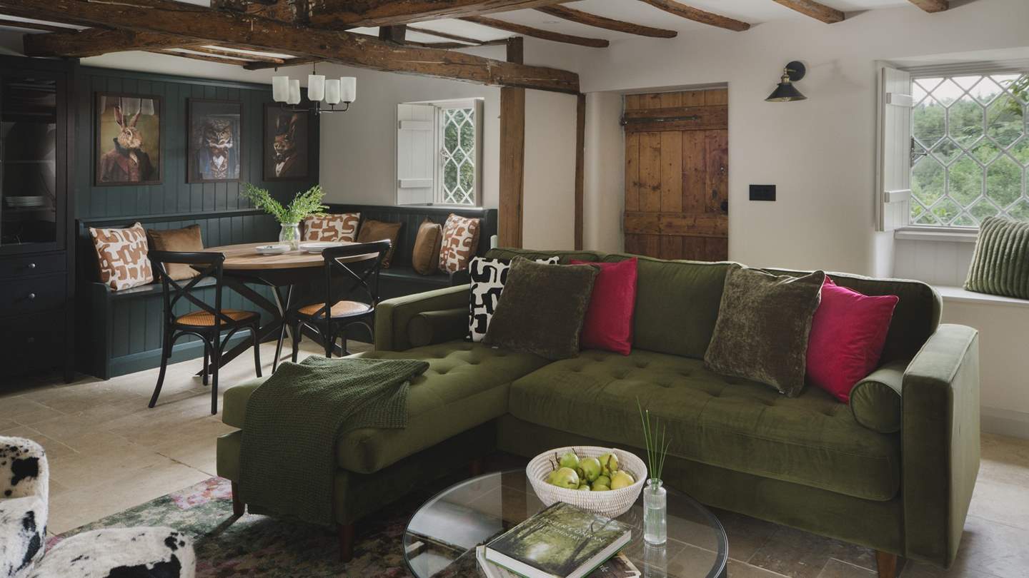 Settle on the L-shaped sofa and cow-print lounge chair to while away heavenly hours by fireside embers