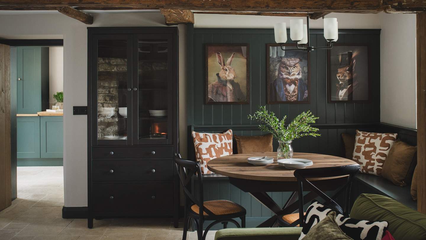 Bespoke banquette seating creates a dreamy dining corner to gather together...