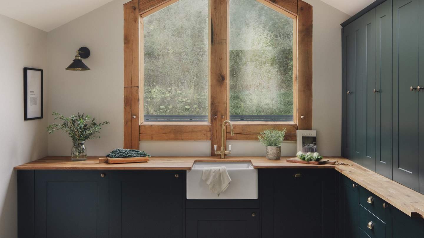 In a striking palette reflecting scenes beyond the windowpane, the kitchen space is a dream for culinary creativity, crafted to inspire your staycation menu...