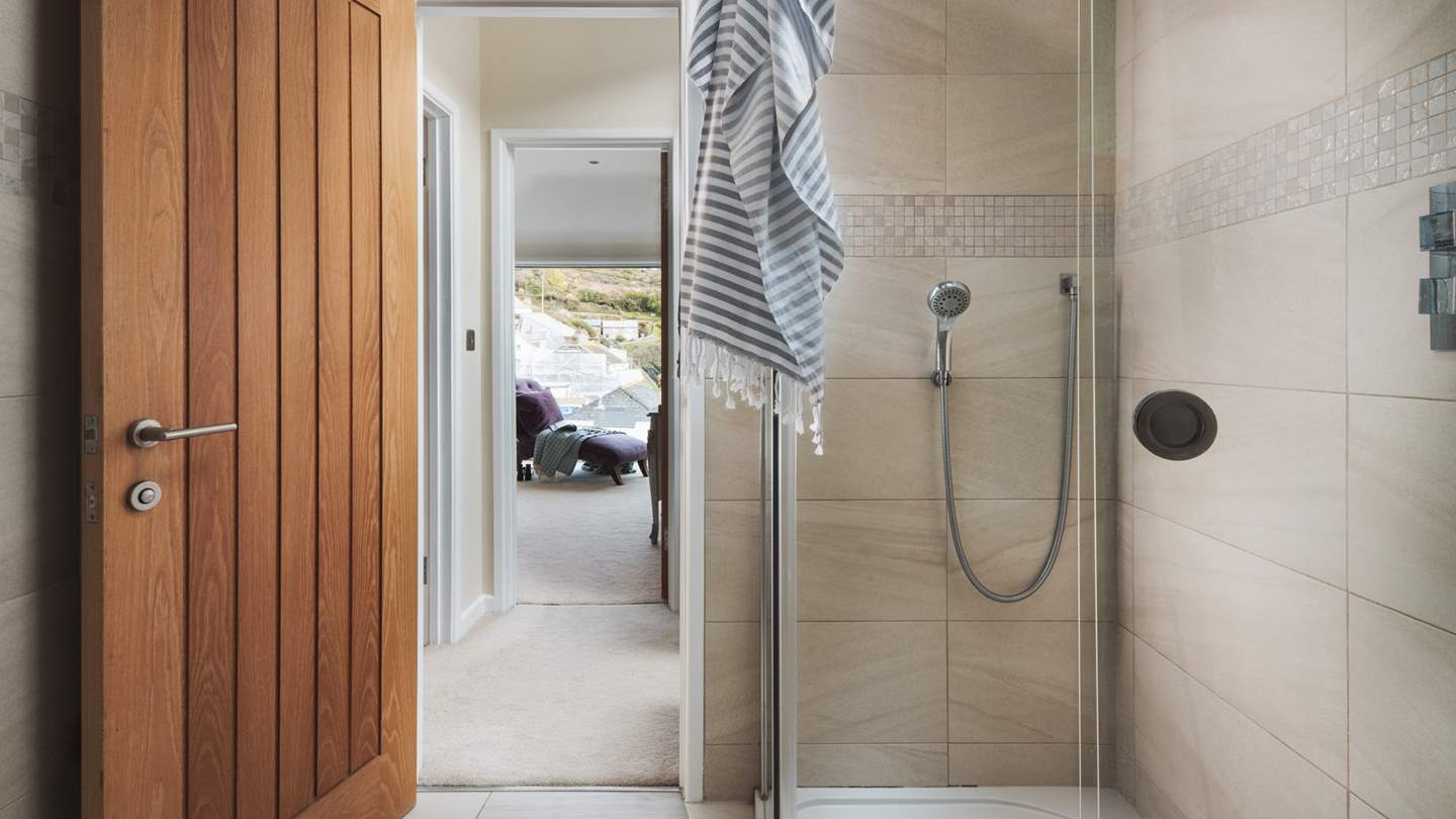 The family shower room can also be found on the first floor and presents a spacious quadrant cubicle with monsoon shower head