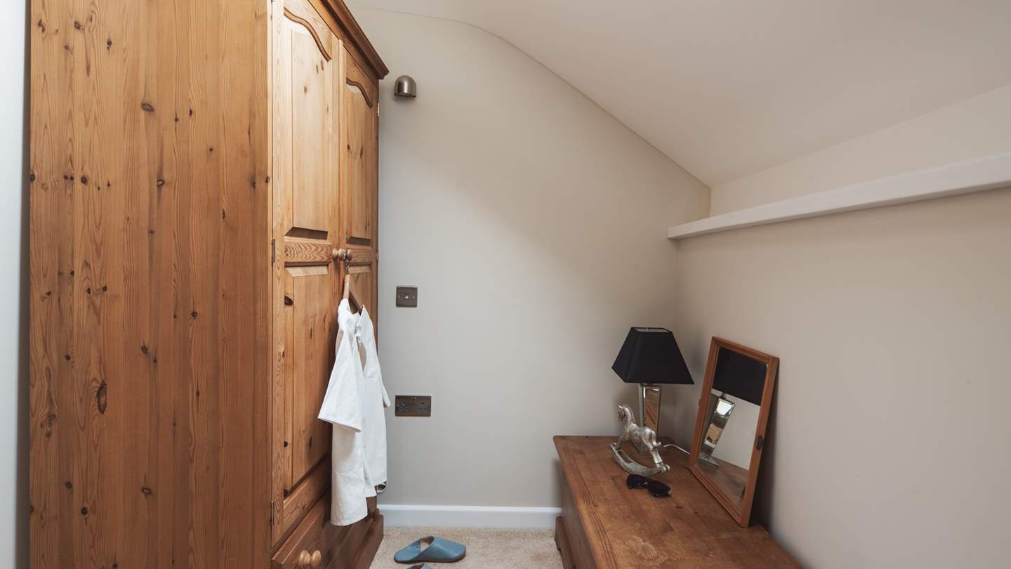 For added convenience, there is a third room complete with a wardrobe and storage for stowing belongings