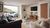 Harbour View is the reincarnation of an 18th century stone-built net loft in the picturesque fishing village of Portloe