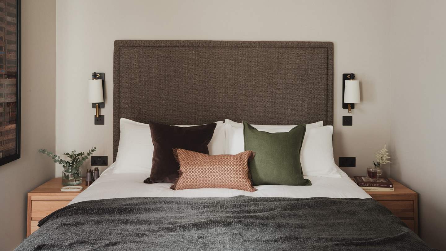 Adorned in calming hues, the second bedroom tempts for early nights and slow mornings