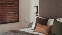 Double-fitted wardrobes and drawers provide space for belongings
