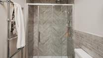 Relish soothing self-care rituals beneath the rainfall shower