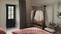 A super king bed is dressed in the finest linens